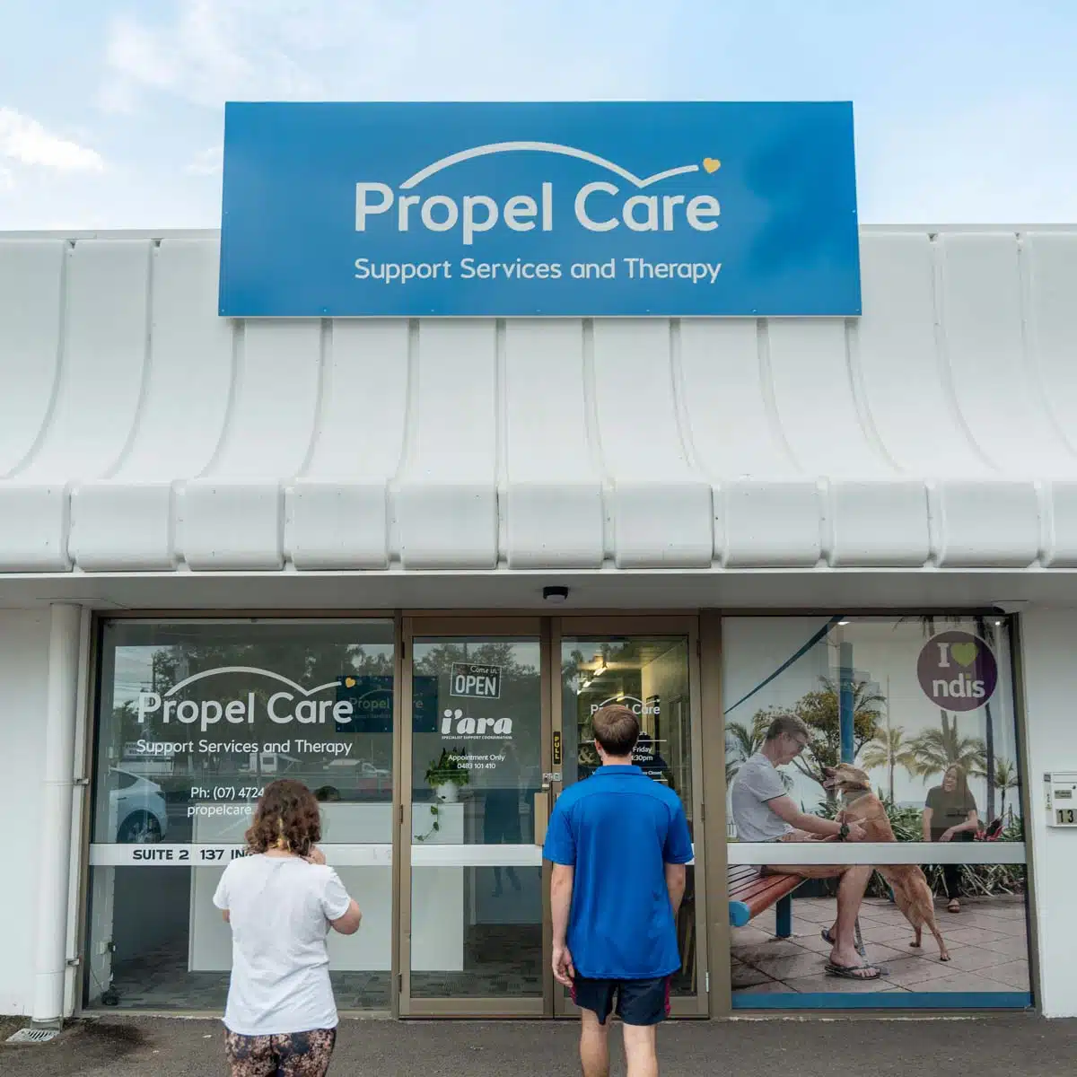 Propel-Care-Office-Web-Square-011 About Propel Care - Two people walking toward the Propel Care Support Services and Therapy office in Townsville,
